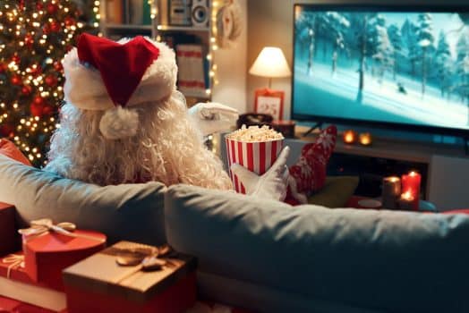 Santa watching movies eating popcorn.